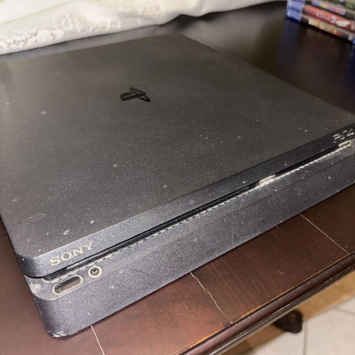 PlayStation 4 Slim used with controller and 7 games, 500GB