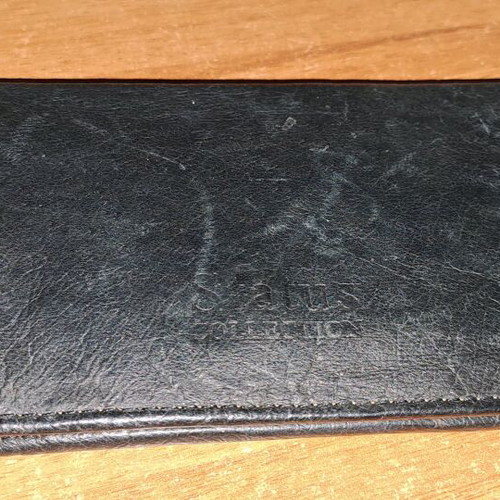 Status leather tobacco pouch used with wear and burn mark