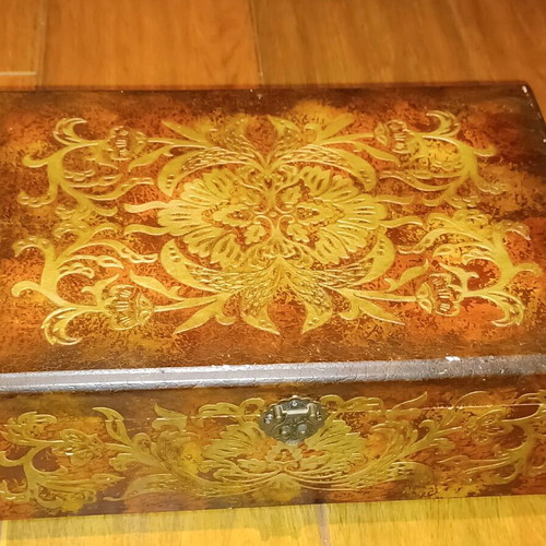 Wooden antique box used with embossed bronze decorations