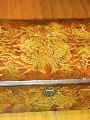 Wooden antique box used with embossed bronze decorations
