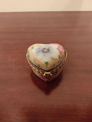 Decorative heart-shaped box used, broken with rust