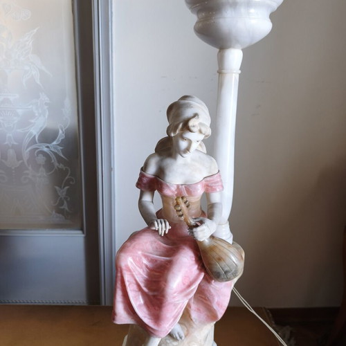 Statue of a woman playing a lute
