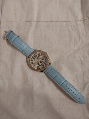 Guess 25th Anniversary Watch with Turquoise and Gold Colors