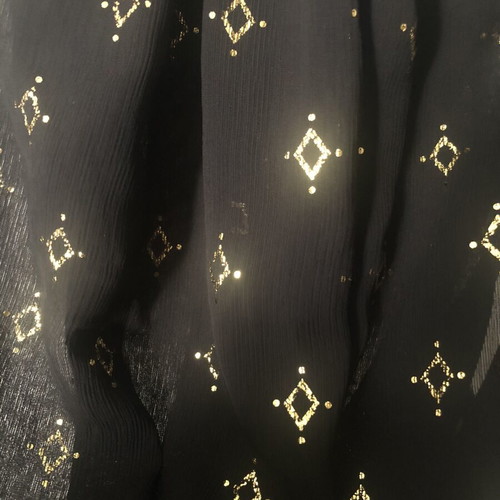 Black sleeveless blouse with gold motifs like new