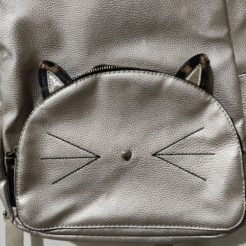 Accessorize backpack used with cat design in gold color