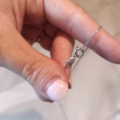 Gold plated cross with zircon like new, silver color