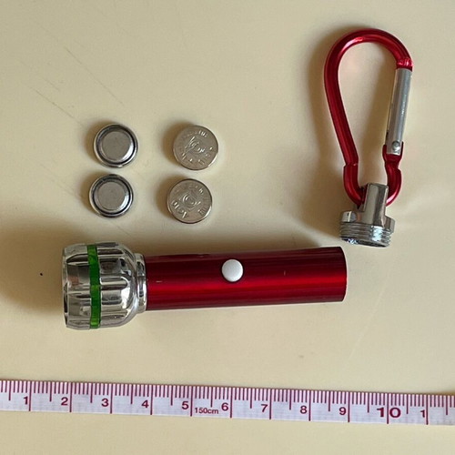 Keychain flashlight like new, requires 4 batteries