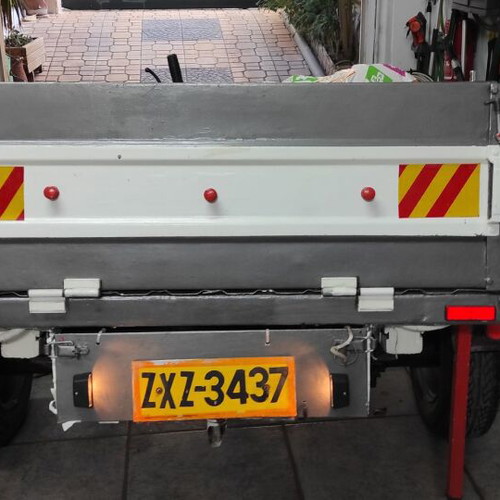 Trailer bag carrier used with removable and folding plywood lid