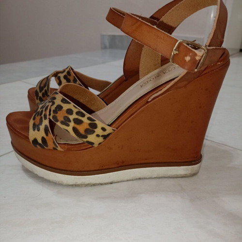 Tan platforms with animal print used, size 38