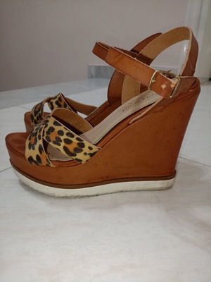 Tan platforms with animal print used, size 38