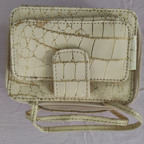 Small gold wristlet shoulder bag