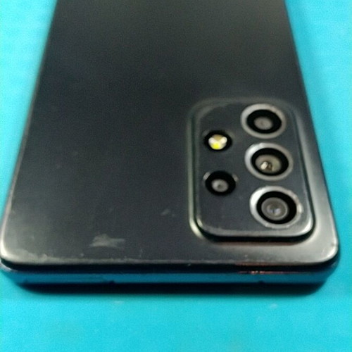 Samsung Galaxy A52s 5G smartphone used with cracked screen, Android 14
