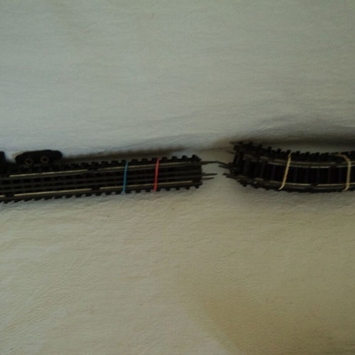 Train set used, engine with three wagons and tracks made in Japan