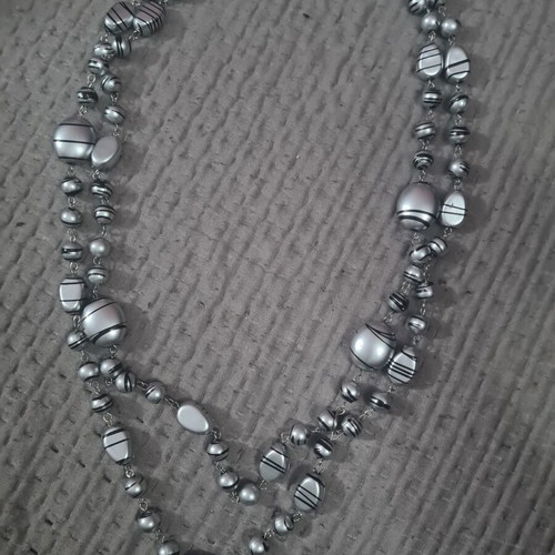 Women's necklace new, long with silver elements and dark stripes