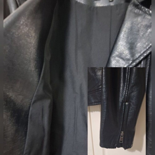 Only black biker jacket made of faux leather with silver details used