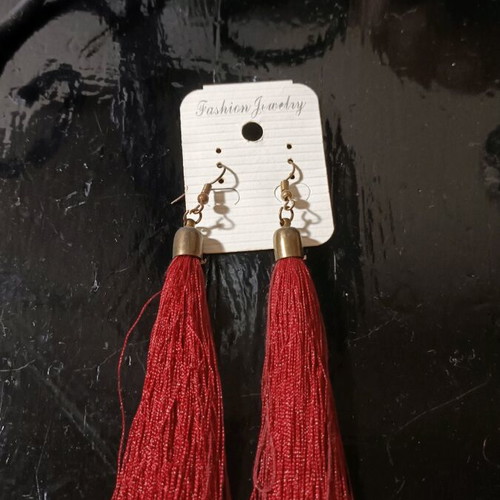 Long earrings used with red tassel