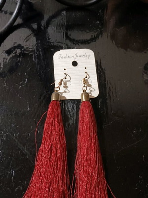 Long earrings used with red tassel