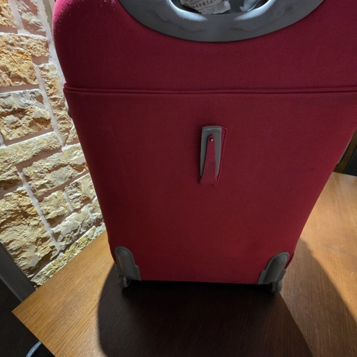 Carpisa 24" travel suitcase used, magenta color, semi-hard fabric