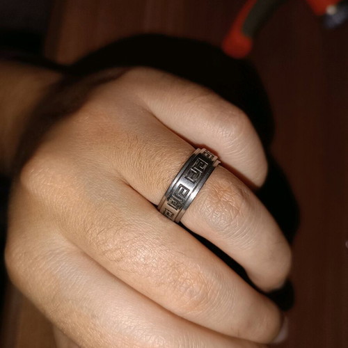 Steel ring used, silver with wear on design color
