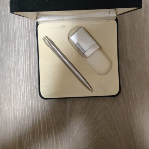 Gift set with lighters, pens, keychain, and calculator