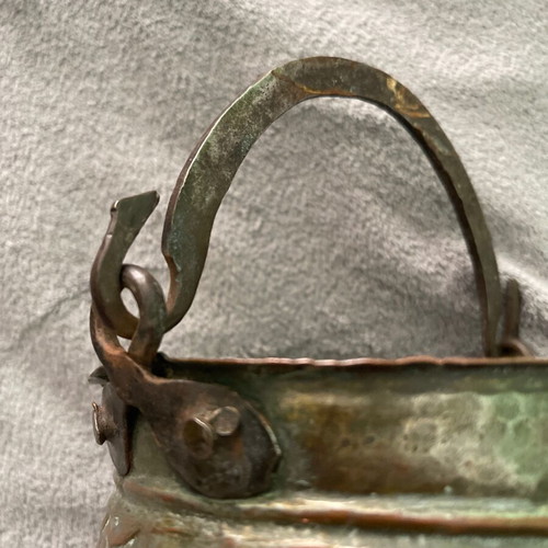 Handmade copper cauldron used with hammered texture and designs