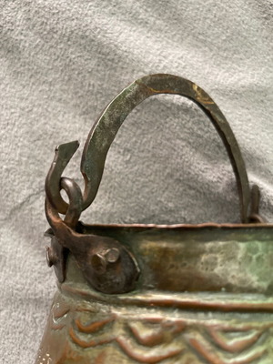 Handmade copper cauldron used with hammered texture and designs