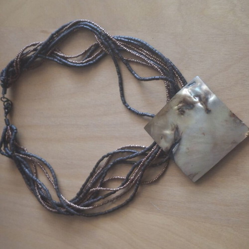 Necklace with large mother-of-pearl plate and beads