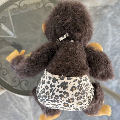 Vintage plush monkey toy with sound and hanging feature