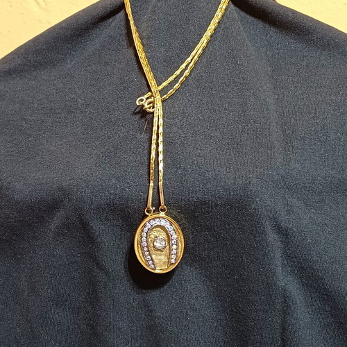 Pendant like new gold-tone horseshoe with zircon crystal