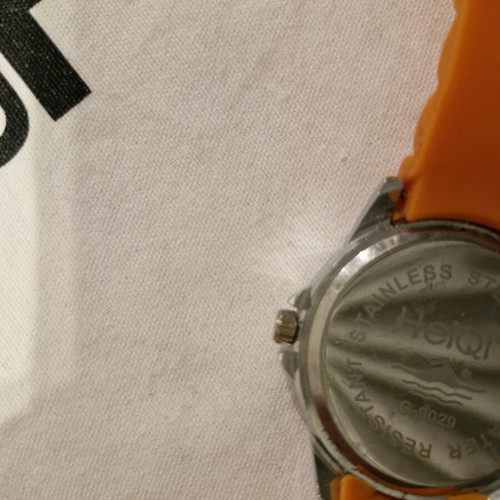 Watch with bright orange silicone strap and dial like new