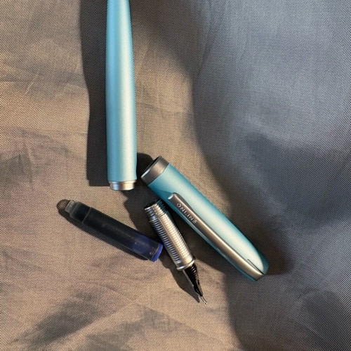 Online pen set like new with black ink and pen