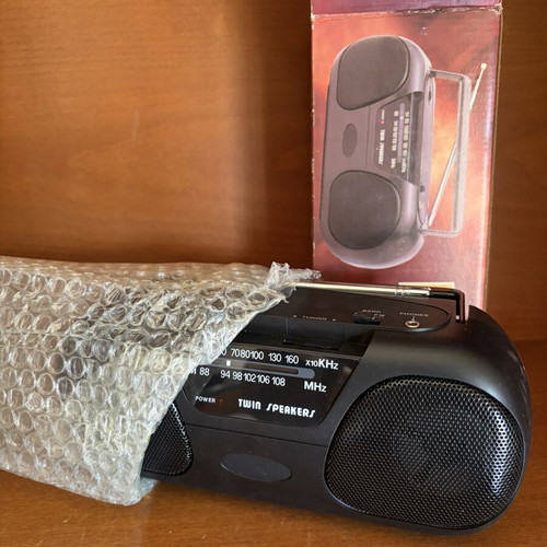 Portable radio with twin speakers