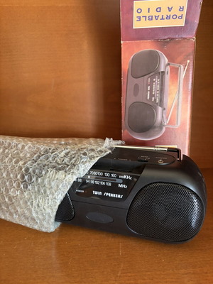 Portable radio with twin speakers