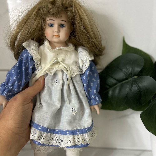 Porcelain doll Germany from the 70s like new