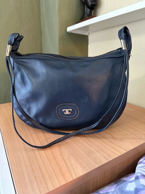 Navy blue shoulder bag made of faux leather used
