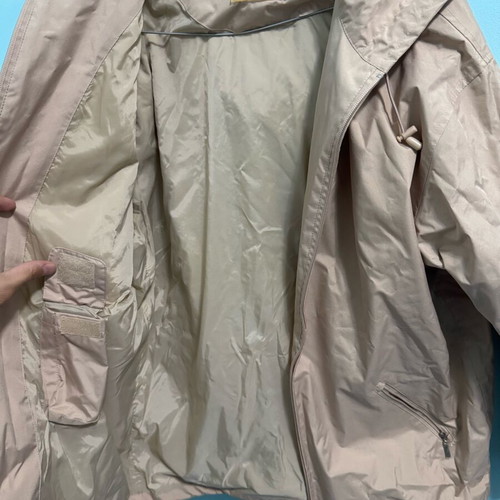 Lightweight waterproof jacket used, beige with hood, size M