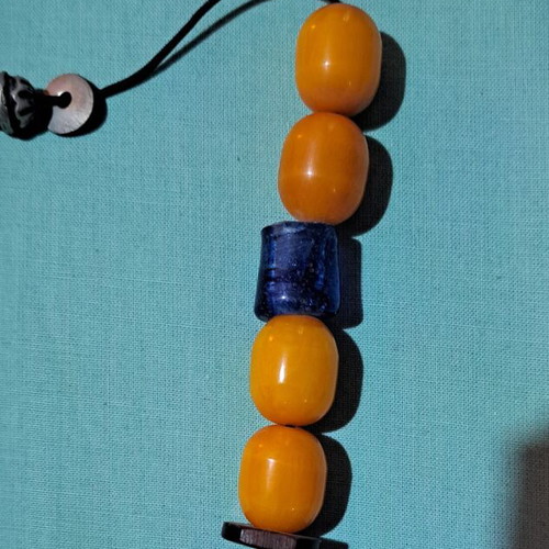 Begleri with 4 large amber-bakelite beads and 1 blue blown glass bead like new