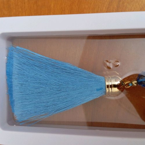 Decorative hanging like new with blue tassel and metal pomegranate