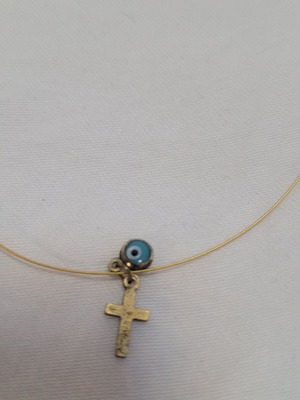 Women's necklace with subtle blue evil eye and cross pendant