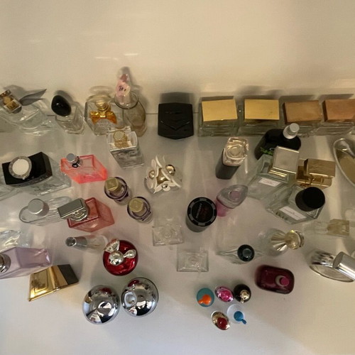 Collection of 44 empty genuine perfume bottles, various brands