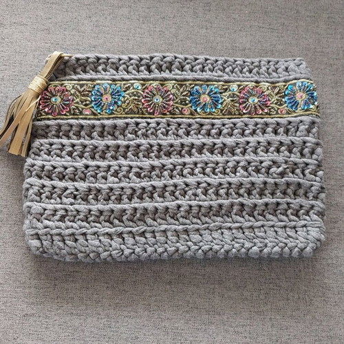 Handmade gray knitted bag new with embroidered border and tassel