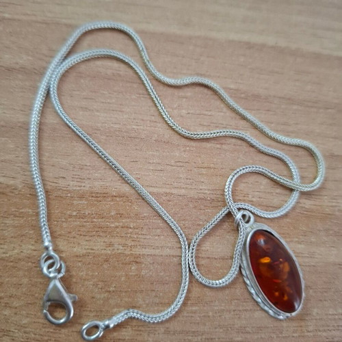 Women's oval pendant with amber and silver chain like new