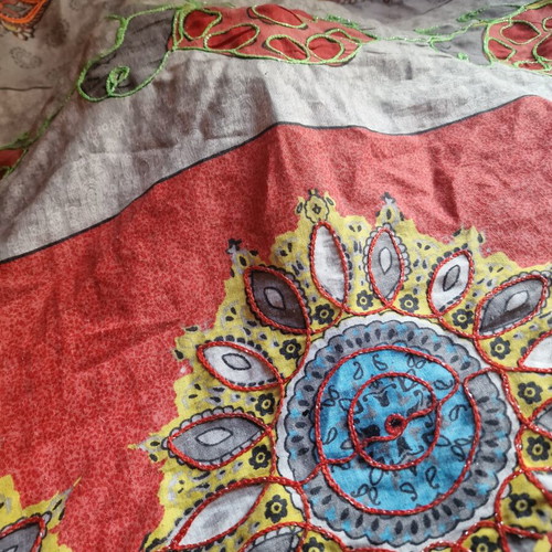 Throw from India used with hand-stitched colorful animal motifs