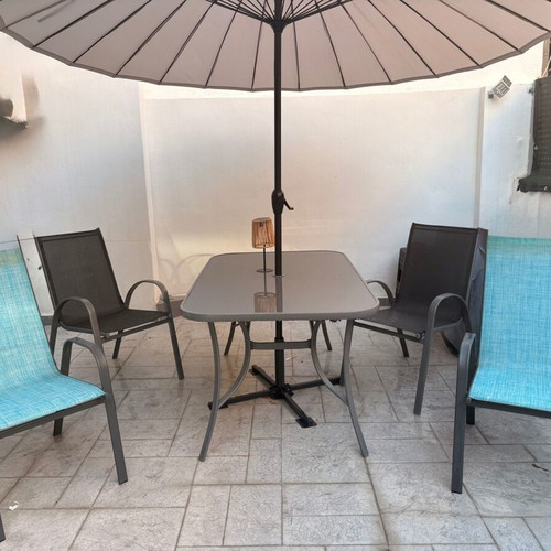 Garden dining set with glass table, umbrella and 4 chairs