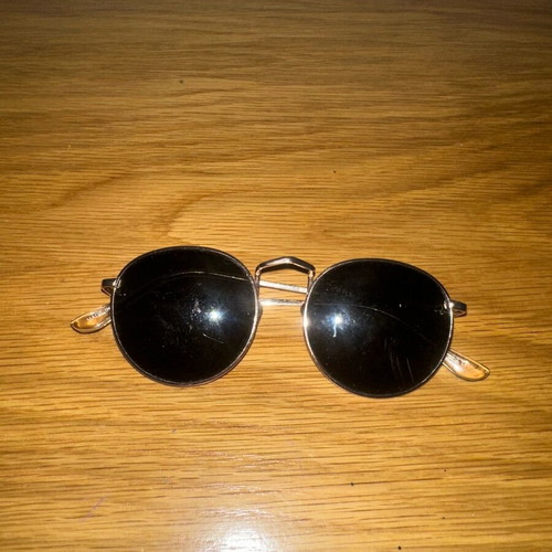 Sunglasses used, black and gold