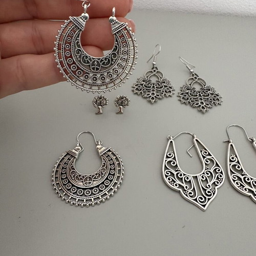 Earring set like new, 3 pairs dangle and 1 pair stud, silver color