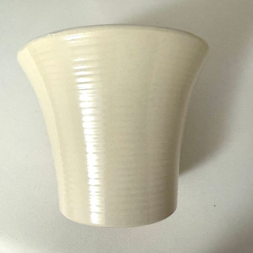 Beige ceramic flowerpot and new