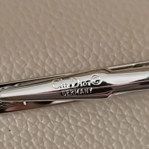 Authentic Dior tie pin new, silver with gold details