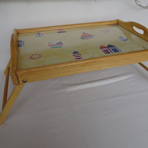 Vintage wooden breakfast tray with nautical theme used