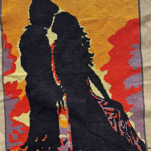 Handmade embroidery used, couple silhouette with sunset